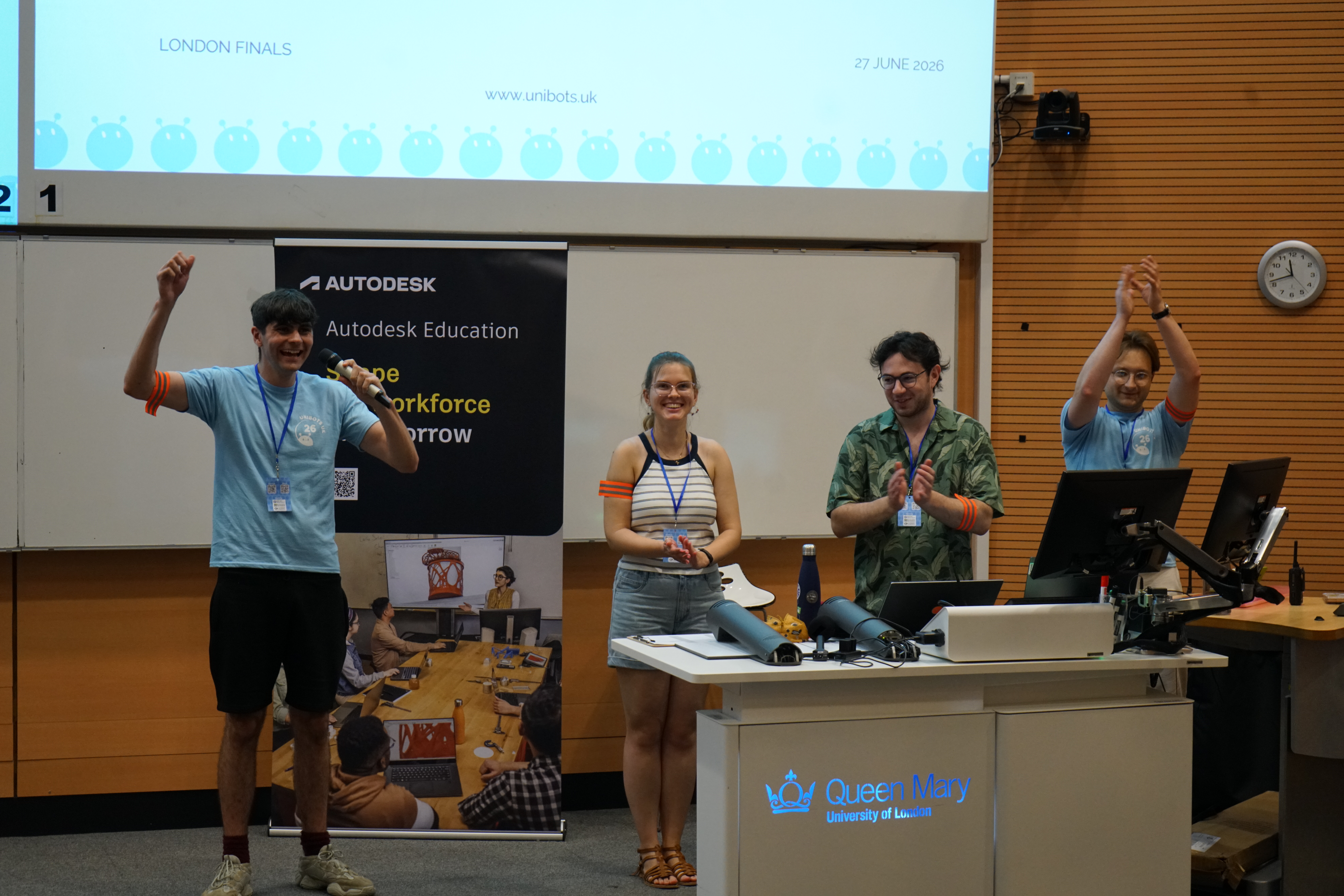 Unibots organisers celebrating with students at the London finals