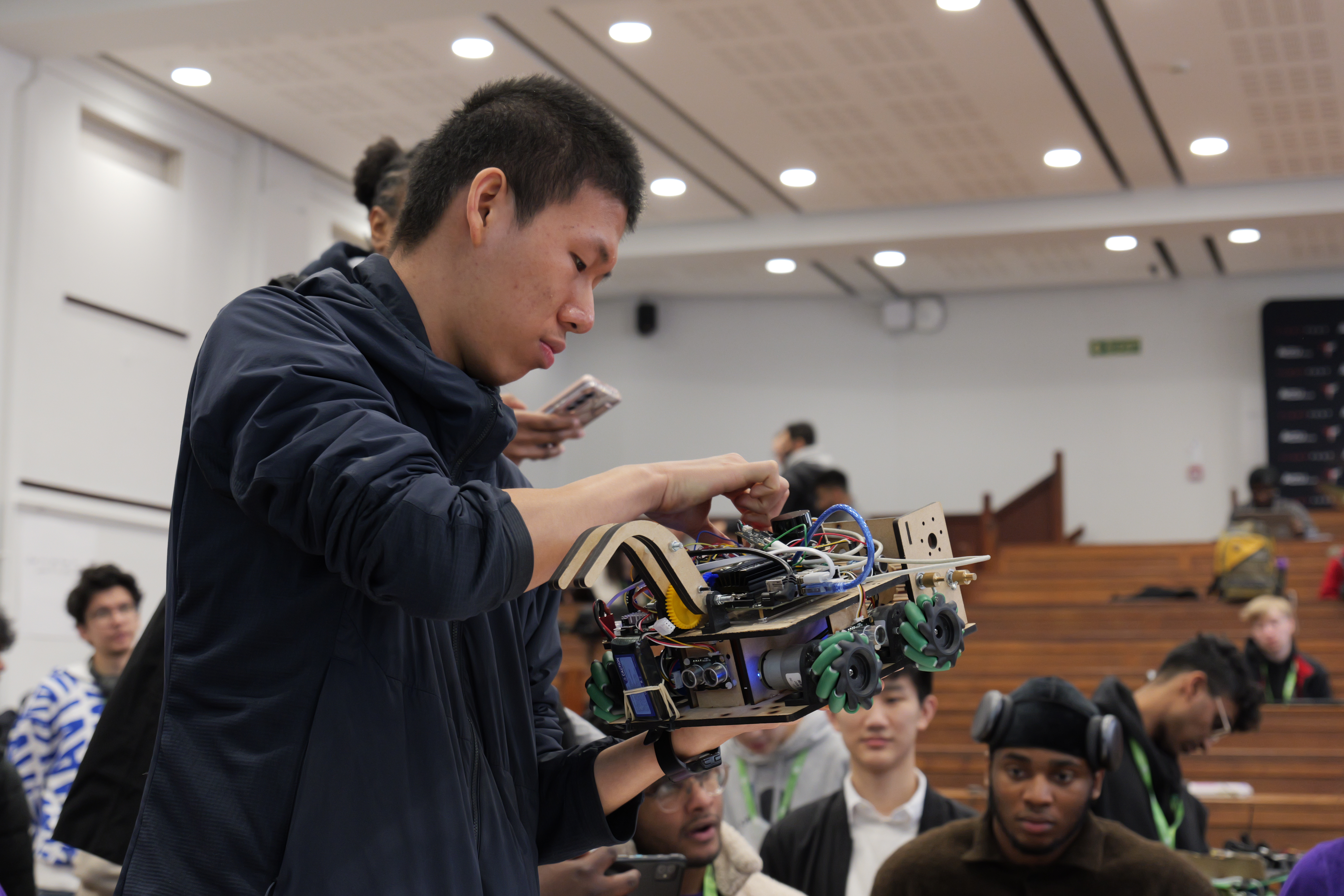 Close-up of a student working on a robot